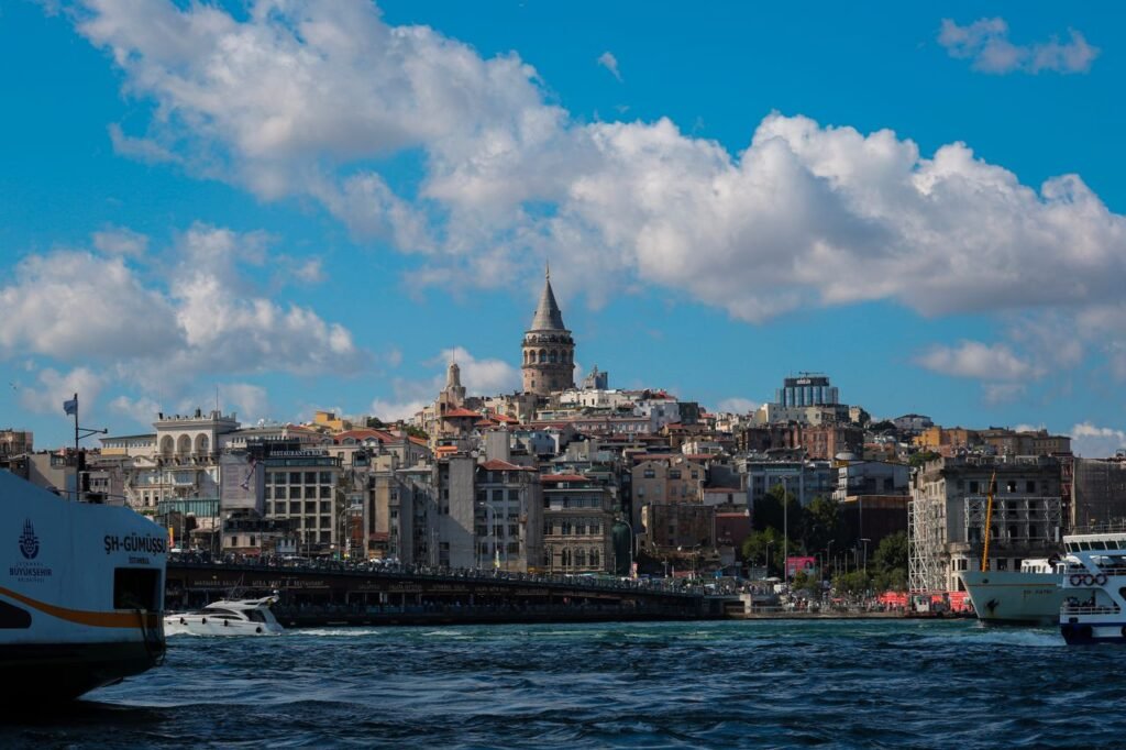 Breathtaking daytime scene of Istanbul's cityscape featuring the iconic Galata Tower and vibrant waterfront.
